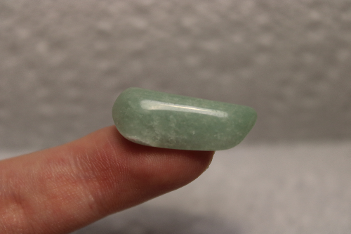 Small polished light green stone.